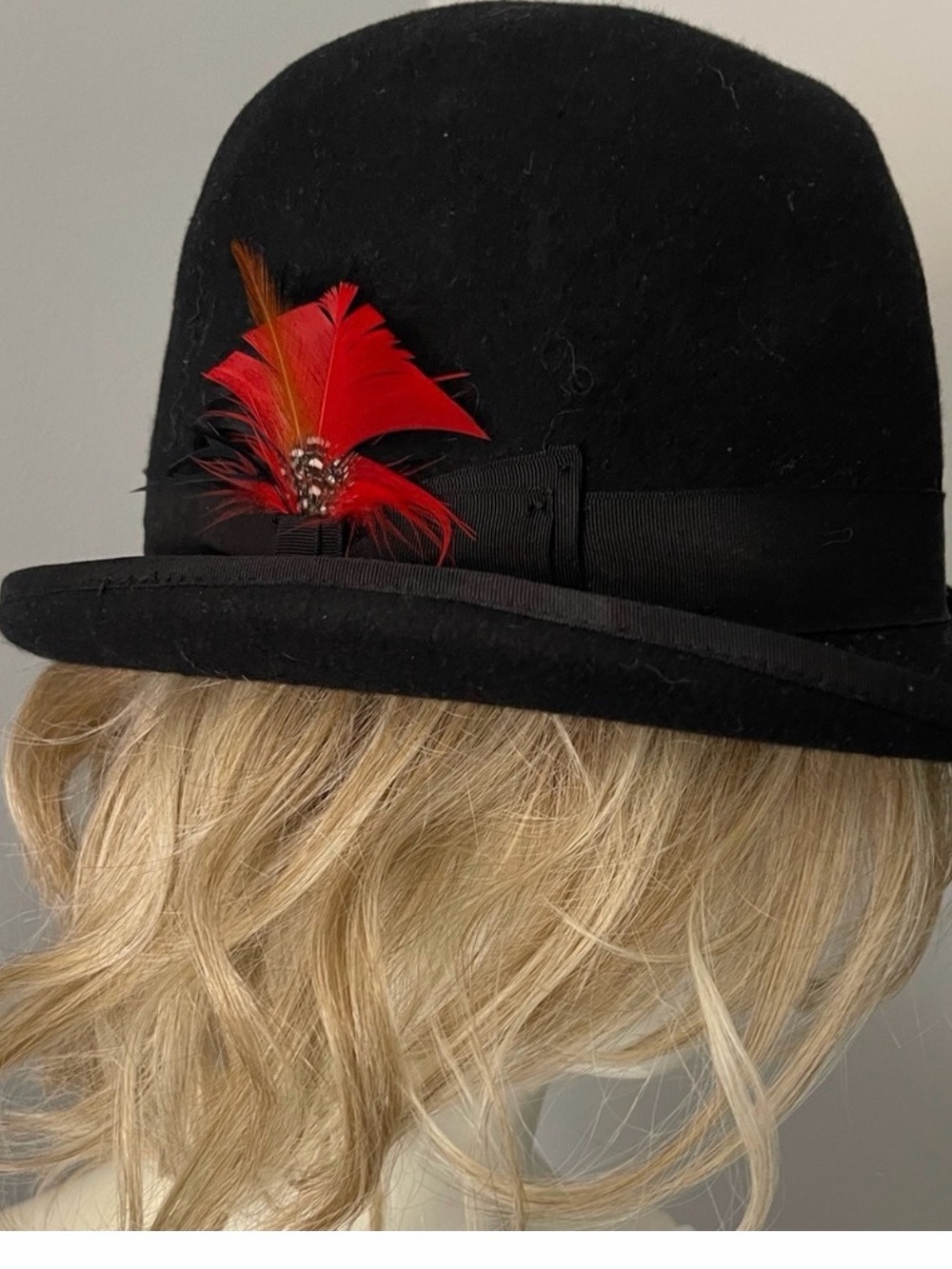 The Derby Black Bowler Hat with Red Feather Accent medium
